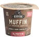A Kodiak Cakes Double Dark Chocolate muffin power cup with a brown label and a lid.