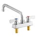 A silver Regency deck-mounted faucet with two knobs.