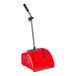 A red plastic dustpan with a handle.