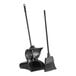 A black dustpan and broom set.