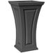 A graphite gray rectangular planter with a curved top on a pedestal.