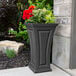 A graphite gray rectangular planter with flowers in it.