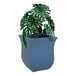 A Neptune Blue Mayne Valencia planter with a plant in it.