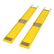 A pair of yellow plastic mats with metal handles.