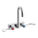 A chrome Regency wall mount faucet with two wrist blade handles.