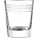 A clear Libbey shot glass with white measurement lines.