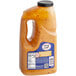 A plastic jug of Sauce Craft Signature Sauce with a label.