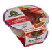 A white Sambazon Berry Bliss Organic Acai Bowl container filled with a purple acai mixture.