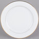 A CAC Golden Royal bright white porcelain plate with a gold rim.