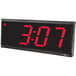 A Pyramid Time Systems 4-digit LED digital clock with red numbers on it.