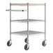 A Regency chrome utility cart with three shelves and wheels.