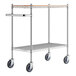 A Regency chrome utility cart with wooden shelves and wheels.