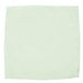 A white microfiber cloth with green trim.