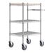 A chrome metal Regency three shelf utility cart with black wheels.