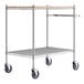 A Regency chrome utility cart with wooden shelves.