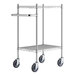 A Regency chrome metal utility cart with two shelves and black wheels.