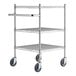 A chrome metal utility cart with three shelves and wheels.