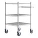 A chrome metal utility cart with three shelves and wheels.