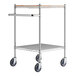 A chrome utility cart with metal and wooden shelves and wheels.