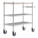 A metal Regency utility cart with three shelves and wheels.