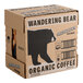A cardboard case of Wandering Bear Organic Black Cold Brew Coffee containing six 32 fl. oz. cartons.