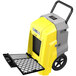 An AlorAir yellow and grey commercial dehumidifier with a black handle and wheels.