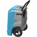 An AlorAir Storm Ultra LGR 90 blue and grey dehumidifier with wheels.