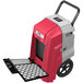 An AlorAir red and grey commercial dehumidifier with a black handle and wheels.