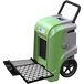 An AlorAir green and grey commercial dehumidifier with a black handle and wheels.