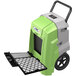 An AlorAir Storm Pro 85 green and grey dehumidifier with a black handle.