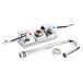 A chrome Equip by T&S wall mount faucet with 2 gooseneck spouts and wrist handles.