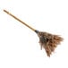 A Lavex feather duster with a wooden handle.