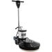 A Clarke floor burnishing machine with a black and silver base and wheels.