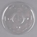 A clear plastic Dart lid with a straw slot over a clear plastic container.