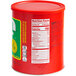 A red container of Jif Creamy Peanut Butter with a label.