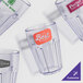 A group of empty customizable clear plastic tumblers.
