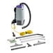 A ProTeam Super Coach vacuum with hose and accessories.