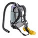 A ProTeam backpack vacuum with a hose attached.