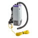 A white ProTeam backpack vacuum with a hose attached.