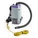 A ProTeam backpack vacuum cleaner with a hose attached.