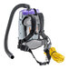 A ProTeam backpack vacuum with a hose.