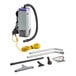 A ProTeam backpack vacuum with hard floor accessories including a nylon brush.