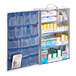 A white metal First Aid Only cabinet with many boxes inside.