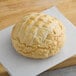 A Vie De France parbaked sourdough bread loaf on a white surface.