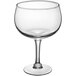 An Acopa clear glass with a stem.