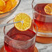 A close up of a bowl of dried clementine orange slices.