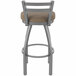 A Holland Bar Stool stainless steel outdoor counter stool with a tan cushioned seat.