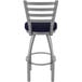 A Holland Bar Stool stainless steel outdoor restaurant bar stool with a blue cushion.