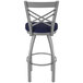 A Holland Bar Stool outdoor extra tall swivel bar stool with a navy blue seat and back.