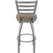 A Holland Bar Stool outdoor counter stool with a beige cushion on the seat and backrest.